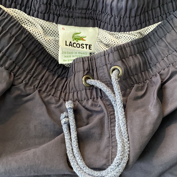 A Lacoste men’s quick-dry swim shorts with built in mesh lining. - Picture 3 of 8